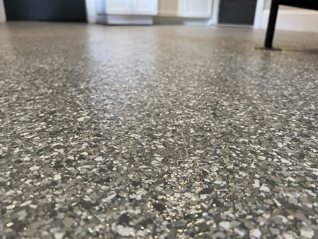 concrete coating with flecks on floor