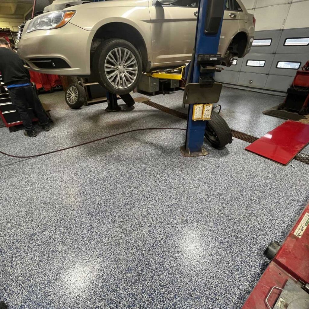 polyurea concrete floor coating in a car shop