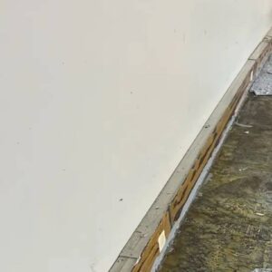 Old baseboard with paint and flakes previous epoxy job - Amber Dr Farmington Hills MI - 2